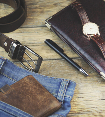 Man different elegant  accessories on wooden background